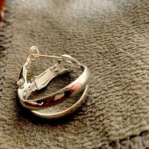 Sterling silver 3/4” lightweight hoop earrings. Good condition. Never worn.